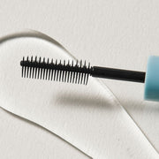 ProtoClinical k-beauty beige beauty graphic with a charcoal horizontal band on a light background.