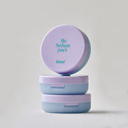 ProtoClinical k-beauty Daleaf Glam Sebum Hair Pact 5g single square hair pact compact centered on a pale lavender background.
