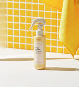 ProtoClinical k-beauty Daleaf Origin No-Wash Treatment 150ml single upright beige treatment bottle centered on a warm yellow background