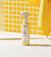 ProtoClinical k-beauty Daleaf Origin No-Wash Treatment 150ml single upright beige treatment bottle centered on a warm yellow background