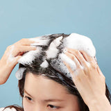 ProtoClinical k-beauty dark blue beauty product silhouette on a pale blue and white background.