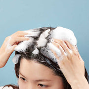 ProtoClinical k-beauty dark blue beauty product silhouette on a pale blue and white background.