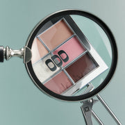 ProtoClinical k-beauty muted rose beauty product silhouette centered on a pale aqua background.