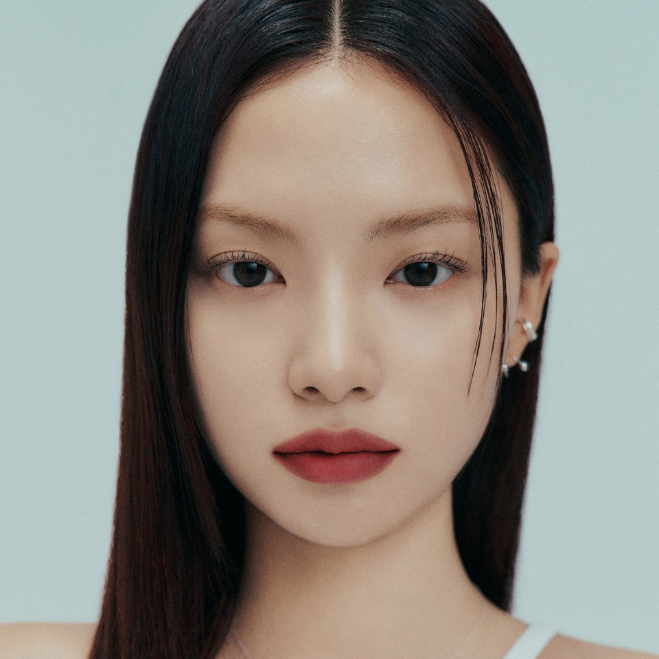 ProtoClinical k-beauty Oddtype Unlimited Curl Lift Mascara single angled mascara tube on a white background with soft lavender side shading