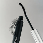 ProtoClinical k-beauty Oddtype Unlimited Curl Lift Mascara single dark upright mascara silhouette on a pale gray background with soft green side shading