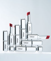 ProtoClinical k-beauty Oddtype Unscene Dew Glow Balm single lip balm detail shown in a vertical close-up on a light background