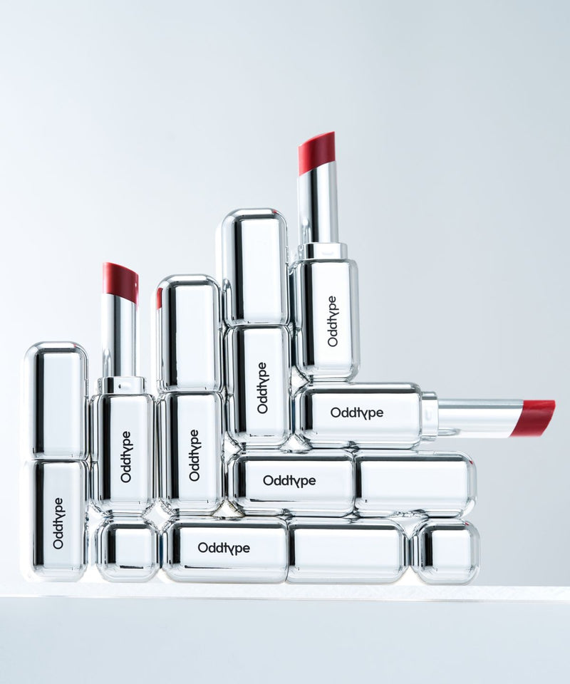 ProtoClinical k-beauty Oddtype Unscene Dew Glow Balm single lip balm detail shown in a vertical close-up on a light background