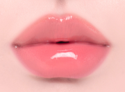 ProtoClinical k-beauty Oddtype Unseen Balloon Tint bright pink lip tint swatch centered on a pale pink background with soft green corner accents