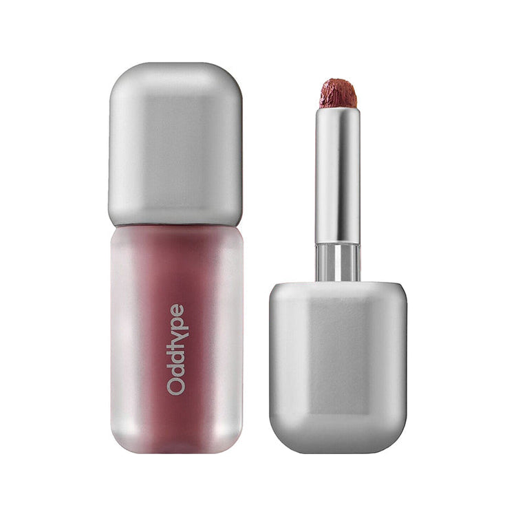 ProtoClinical k-beauty Oddtype Unseen Blur Tint two upright lip tint tubes side by side on a white background with pale mint side gradients