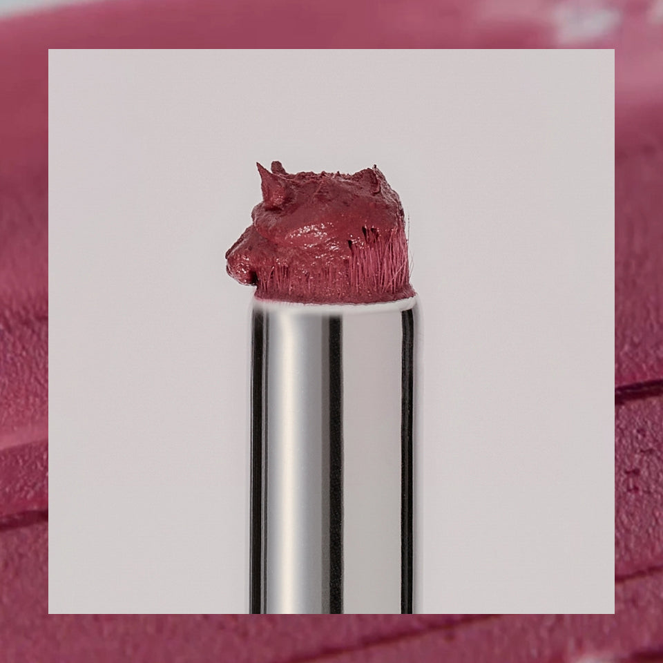 ProtoClinical k-beauty Oddtype Unseen Blur Tint single upright lip tint tube centered on a pale mauve and taupe background