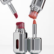 ProtoClinical k-beauty Oddtype Unseen Mirror Tint single upright lip tint tube centered on a pale nude pink background