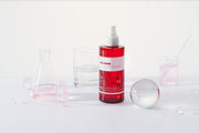 ProtoClinical k-beauty PAUL MEDISON Signature Body Mist 211ml #White Musk single translucent red body mist bottle centered among clear glassware on a clean white background