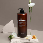 ProtoClinical k-beauty PAUL MEDISON Signature Perfume Collection Body Lotion 1600ml #White Musk in a tall dark brown bottle standing upright on a beige background