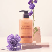 ProtoClinical k-beauty KUNDAL EAU THERMALE SPA SCRUB BODY WASH 500ml #LEATHER IRIS single upright scrub body wash bottle centered on a light background.