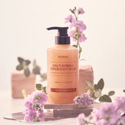 ProtoClinical k-beauty KUNDAL EAU THERMALE SPA SCRUB BODY WASH 500ml #VIOLET MUGUET single upright scrub body wash bottle centered on a light background.