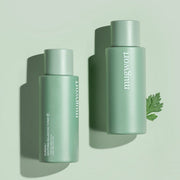 ProtoClinical k-beauty KUNDAL Mugwort Soothing Balancing Toner 200ml pair of deep green beauty bottles on a pale sage background.