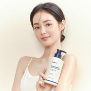 ProtoClinical k-beauty KUNDAL RICH SOYMILK BODY CREAM 500ml #Mellow Vanilla tall beige body cream bottle with soft blue side accents on a white background.
