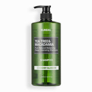 ProtoClinical k-beauty tall green skincare product centered on a pale white and pink background.