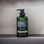 ProtoClinical k-beauty dark gray skincare product centered on a soft gray background.