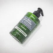 ProtoClinical k-beauty green skincare product angled across a pale pink and cream background.