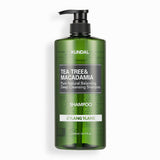 ProtoClinical k-beauty KUNDAL Tea Tree & Macadamia Deep Cleansing Shampoo 1058ml #YLANG YLANG single upright dark green shampoo bottle centered on a light background.