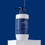 ProtoClinical k-beauty Dr.BANGGIWON LAB SHAMPOO RX 480ml single upright blue shampoo bottle centered on a dark blue background.
