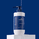 ProtoClinical k-beauty Dr.BANGGIWON LAB SHAMPOO RX 480ml single upright blue shampoo bottle centered on a dark blue background.