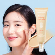 ProtoClinical k-beauty DR.BANGGIWON Personal Tone Up Sun Cream #02 Beige 50ml SPF50+ PA++++ close-up model portrait on a blue-gray background.