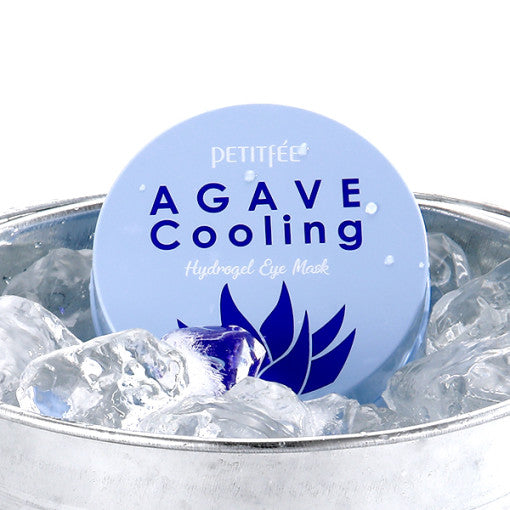 ProtoClinical k-beauty PETITFEE Agave Cooling Hydrogel Eye Mask 80g (60 Patches) deep blue eye mask package centered on a light background with warm cream side shading