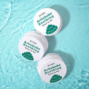 ProtoClinical k-beauty PETITFEE Artichoke Soothing Hydrogel Eye Mask 80g (60 Patches) single upright eye mask package centered on a bright aqua background with a pale vertical center band