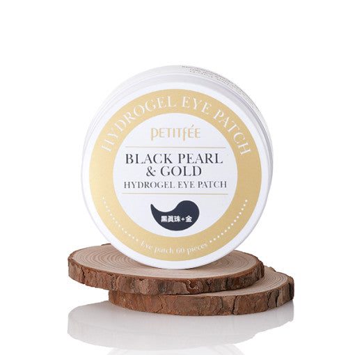 ProtoClinical k-beauty PETITFEE Black Pearl & Gold Hydrogel Eye Patch (1.4g X 60 Patches) open beige round jar above a dark brown lid on a white background