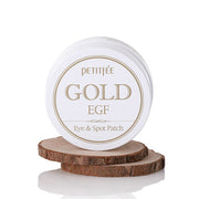 ProtoClinical k-beauty PETITFEE GOLD EGF EYE & SPOT PATCH (EYE patch 1.1g X 60 Patches + SPOT patch 0.6g X 30 Patches) single dark round eye patch jar centered on a white background with pale lilac top shading