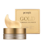ProtoClinical k-beauty PETITFEE Gold Hydrogel Eye Patch (1.4g X 60 Patches) single warm gold package laid horizontally on a pale blue and cream background