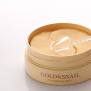 ProtoClinical k-beauty PETITFEE Gold Snail Hydrogel Eye Patch (1.4g X 60 Patches) single warm gold package laid horizontally on a pale blue and cream background