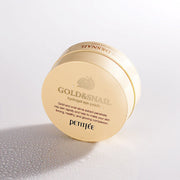 ProtoClinical k-beauty PETITFEE Gold Snail Hydrogel Eye Patch (1.4g X 60 Patches) single pale beige package standing upright on a light background with pale blue and lilac shading