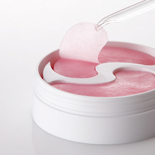 ProtoClinical k-beauty PETITFEE Pink Vita Brightening Eye Mask 70g (60 Patches) single bright pink package laid horizontally on a pale aqua and white background