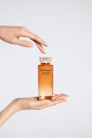ProtoClinical k-beauty Sulwhasoo Concentrated Ginseng Rejuvenating Water 150ml soft peach product image with pale blue side tones on a light background.