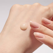 ProtoClinical k-beauty Sulwhasoo The Ultimate S Serum 50ml serum texture with a hand on a light background.
