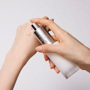 ProtoClinical k-beauty Sulwhasoo The Ultimate S Serum 50ml serum texture with a hand on a light background.