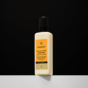 ProtoClinical k-beauty BARBER501 ALL-IN-ONE Moisturize 200ml #VITA single upright beige bottle centered on a dark background with a bright white base