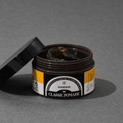 ProtoClinical k-beauty BARBER501 BEER METTO EXTREME CLASSIC POMADE 100g single squat dark pomade jar centered on a muted gray-lavender background