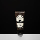 ProtoClinical k-beauty BARBER501 BEER METTO VOLUMIZING CURL CREAM 100ml single upright dark bottle centered on a black background with a white base