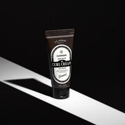 ProtoClinical k-beauty BARBER501 BEER METTO VOLUMIZING CURL CREAM 100ml single curved light tube on a black background with soft gray side highlights