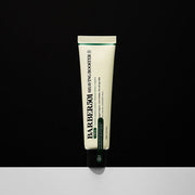 ProtoClinical k-beauty slim beige skincare product centered on a dark background with a soft white base.
