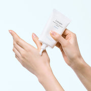 ProtoClinical k-beauty warm beige beauty product detail on a light background.