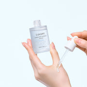 ProtoClinical k-beauty soft gray beauty product detail on a pale blue background.
