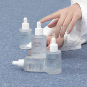 ProtoClinical k-beauty blue and gray beauty product detail on a muted background.