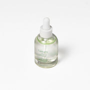 ProtoClinical k-beauty Luvum Calming Repair Cica Oil Serum 30ml pale green and beige product packaging with a centered silhouette on a light background