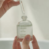 ProtoClinical k-beauty Luvum Calming Repair Cica Oil Serum 30ml pale green and beige product packaging with a centered silhouette on a light background