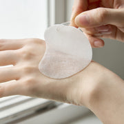 ProtoClinical k-beauty pale green beauty product detail with cream and beige tones on a light background.
